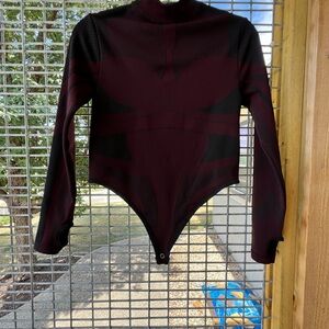 Long sleeved Maroon and Black Women’s One Piece Athletic Bodysuit
